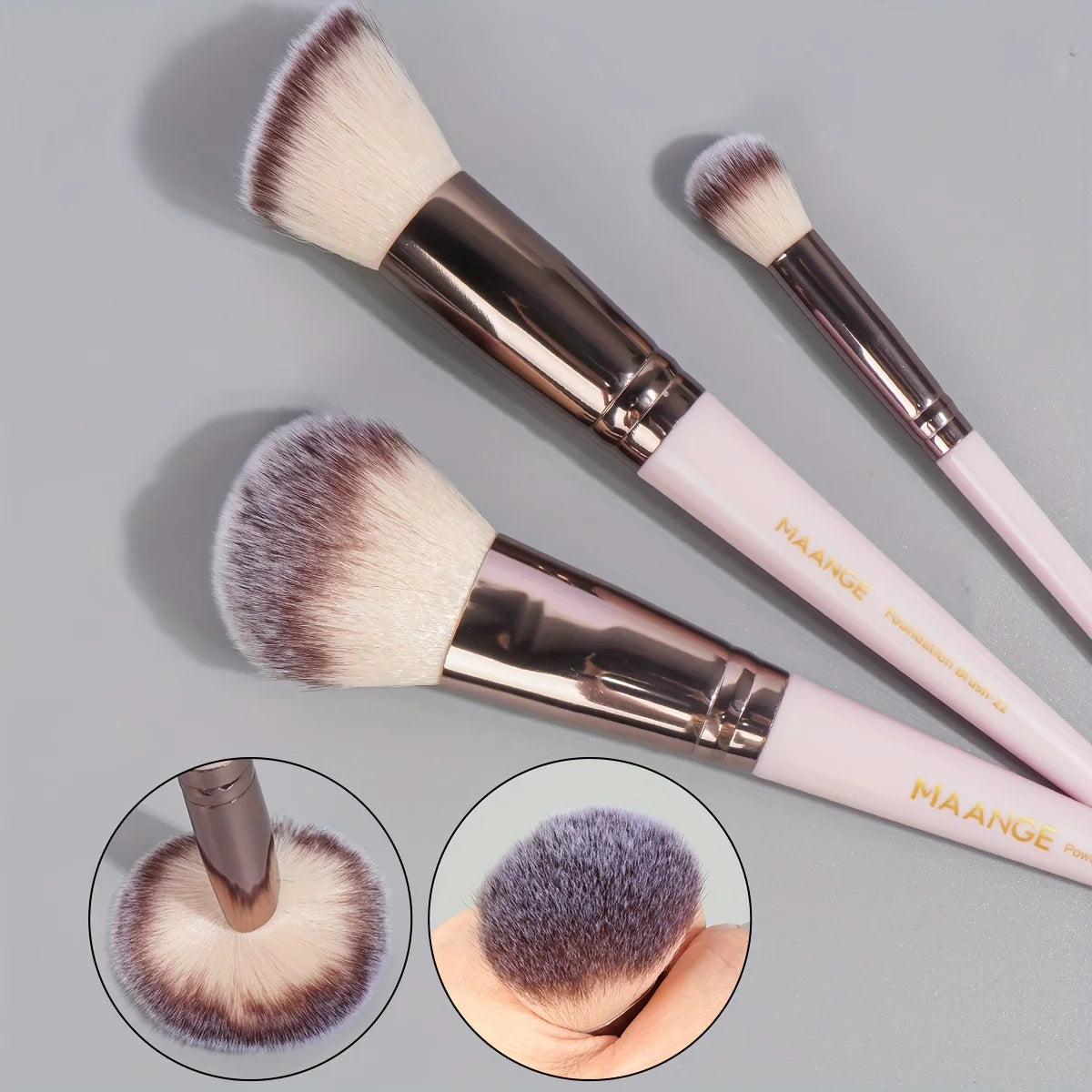 Zoom sur trois pinceaux de maquillage MAANGE à poils denses et doux, conçus pour une application uniforme du maquillage.